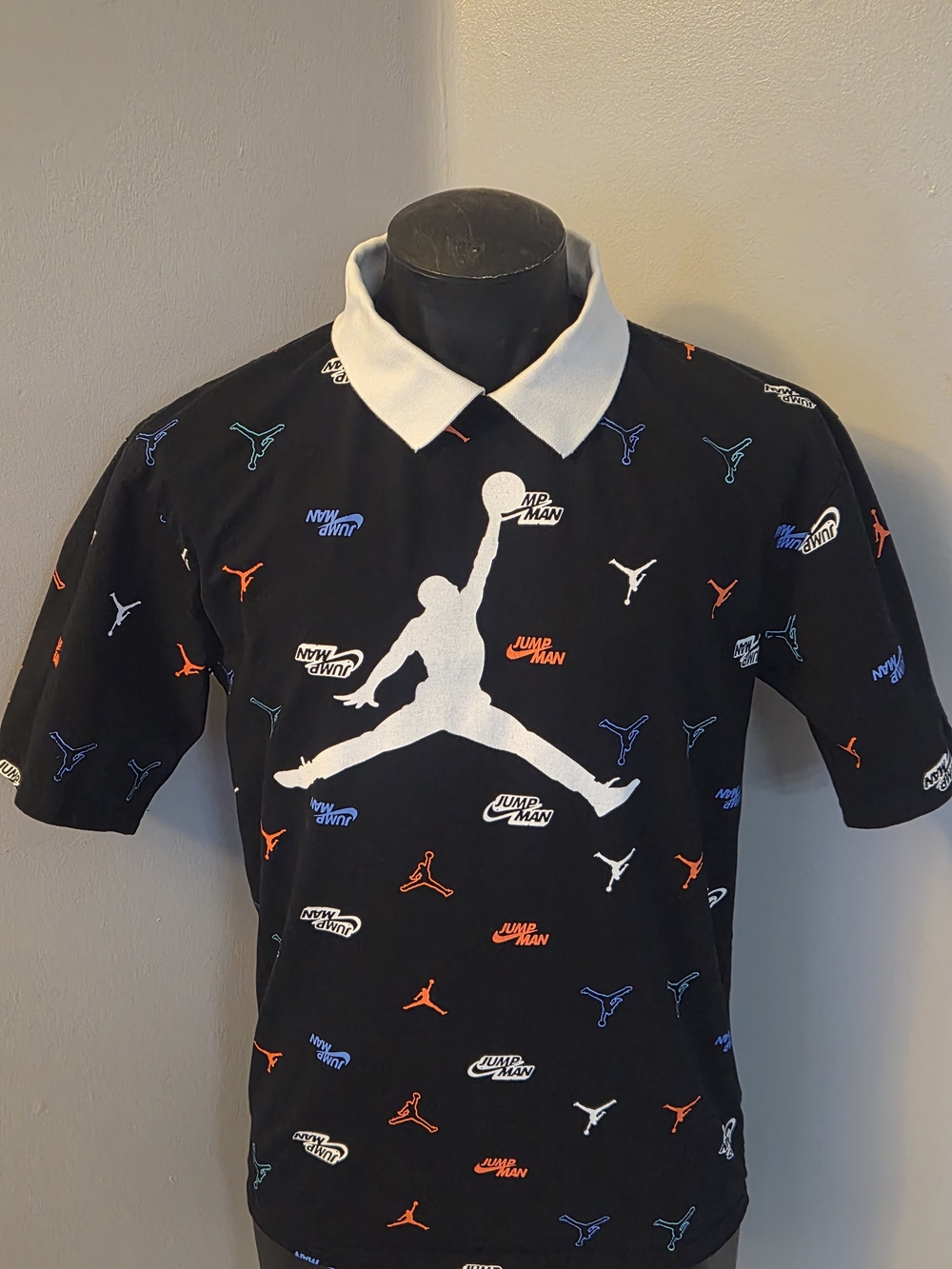 Jordan Black Polo with White Collar and Orange, Blue & Teal Jumpman Prints